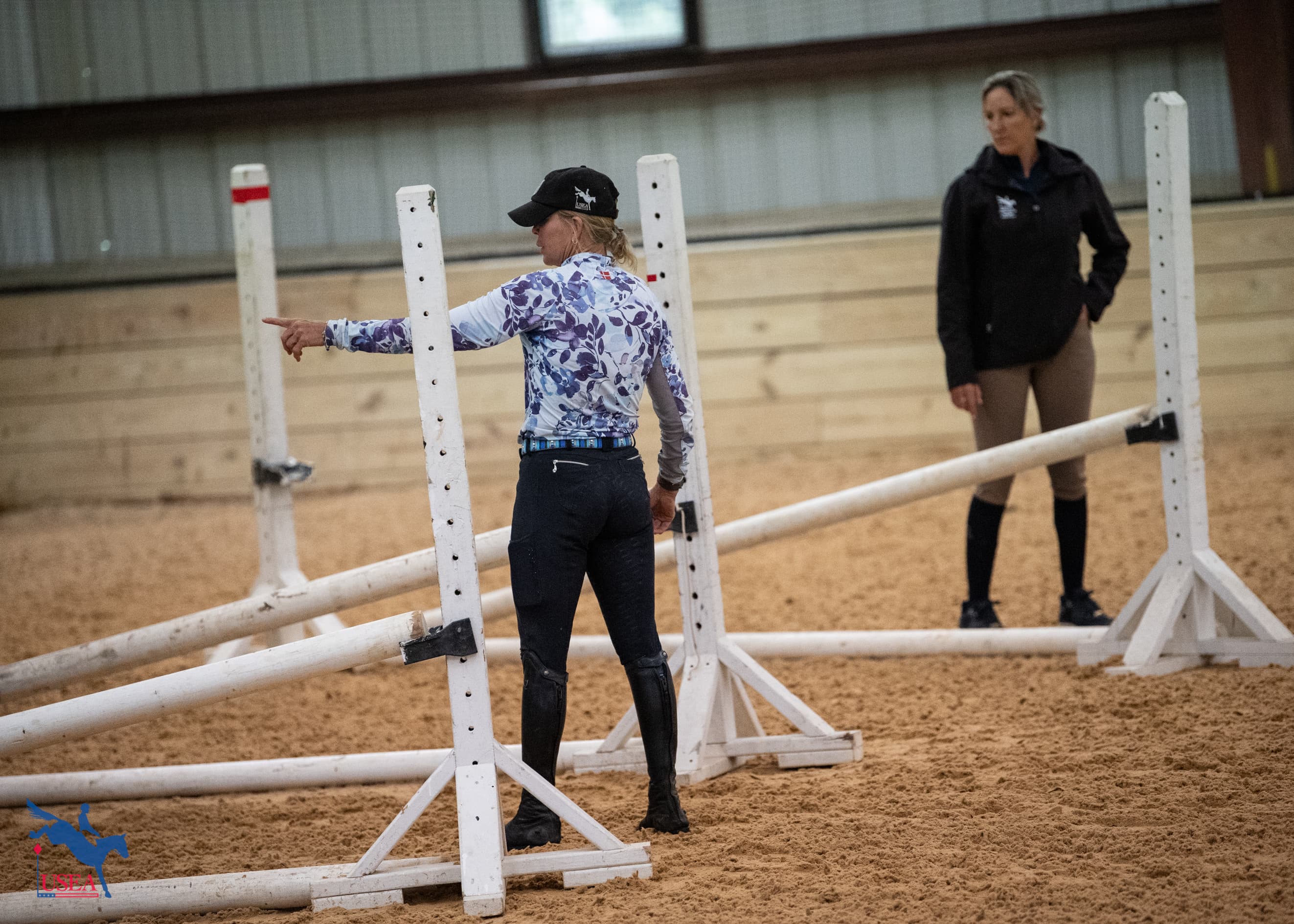 EA21 coach Jan Byyny stopped by to help set fences. USEA/Lindsay Berreth photo