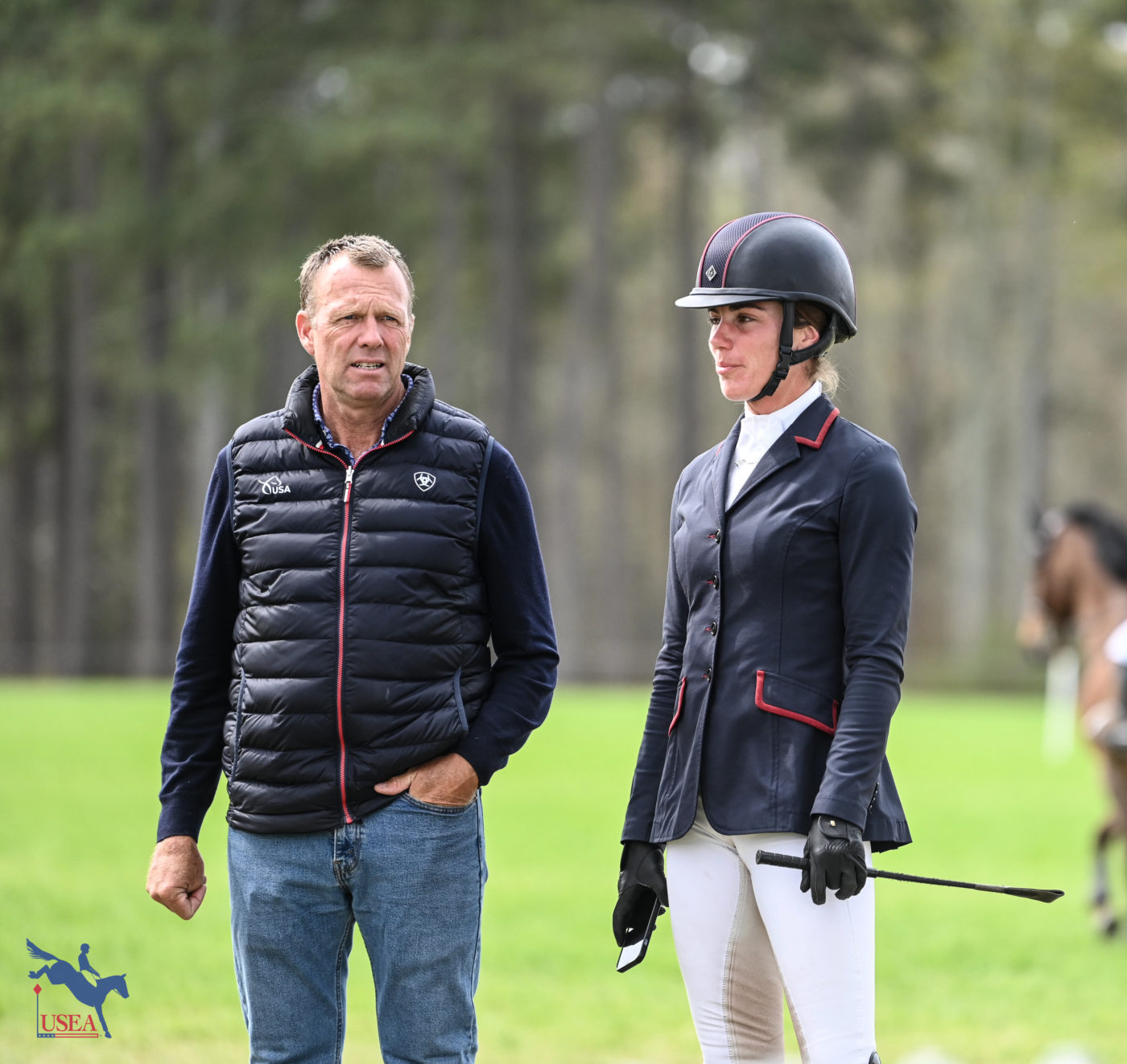 Nothing like a little pre-ride pep talk. Ariel Grald and U.S. team show jumping coach Peter Wylde. USEA/Lindsay Berreth photo