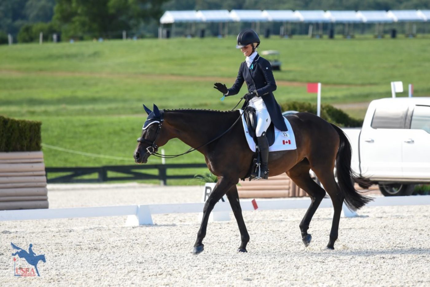 Shelby Brost loving on Crimson after their dressage test. USEA/Jessica Duffy Photo.